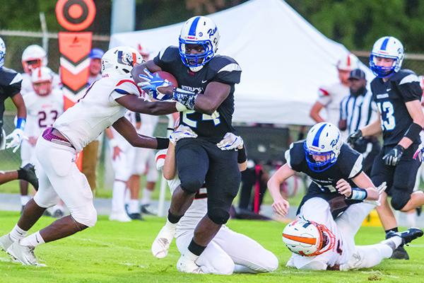 Interlachen’s D.J. Polite runs through a series of arm tackles for 78 yards and a touchdown on the Rams’ first play. (FRAN RUCHALSKI / Palatka Daily News)