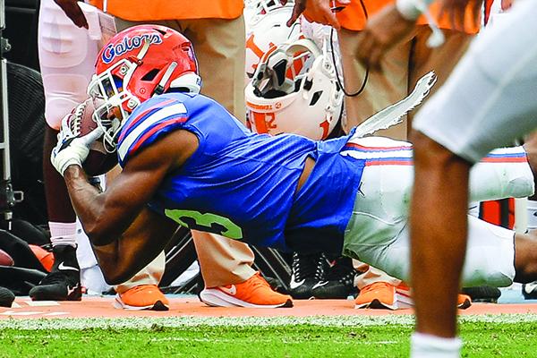 Marco Wilson makes a sideline interception for the Gators, who had three picks Saturday. (JOHN STUDWELL / Special To The Daily News)