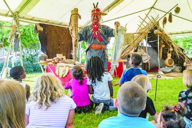 Local students learn about 18th-century artifacts and ways of life during the lead up to the Bartram Frolic.