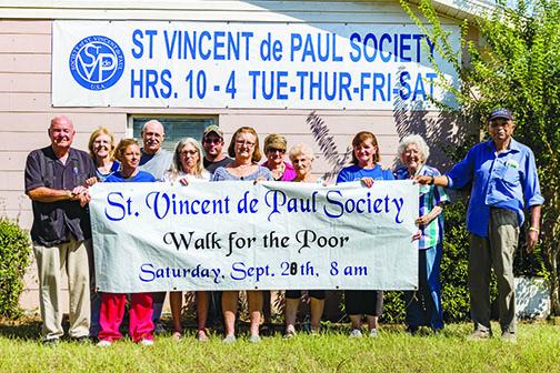 Officials from St. Vincent de Paul Society prepare for the Walk/Run for the Poor.