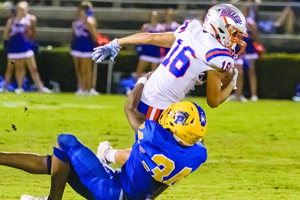 Palatka High junior David Williams wraps up Bolles sophomore Landen Frazier in the second quarter of their game Friday night.  (FRAN RUCHALSKI / Palatka Daily News)