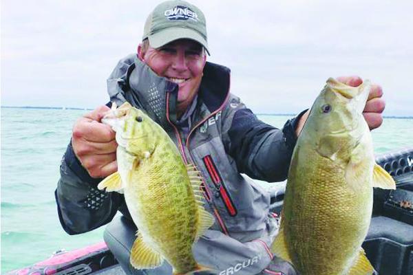 Cliff Prince holds up two of his largest fish on the final day of AOY Championship on Lake St. Clair in Michigan. (Special To The Daily News)