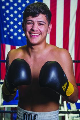 Crescent City High School senior Michael Garcia recently became a professional boxer on his 18th birthday.