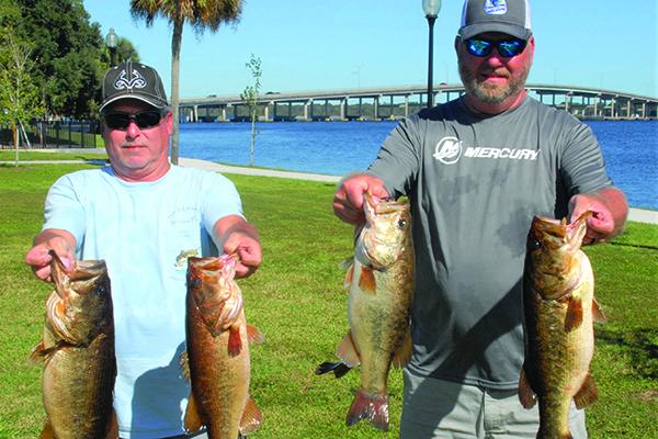 Classic winners Alan Hopper, left, and Chad Willoughby with their winning catches on Saturday. (GREG WALKER / Special To The Daily News)
