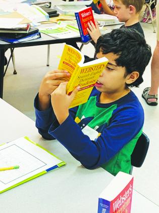 Middleton-Burney students receive dictionaries from local civic groups.