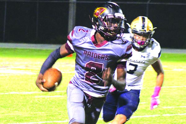 Pictured against University Christian last week, Naykee Scott ran for four touchdowns Friday. (MARK BLUMENTHAL / Palatka Daily News)