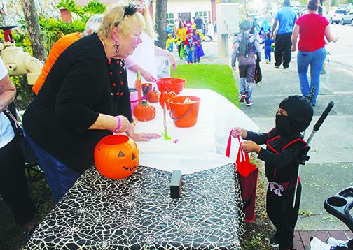 Families participate in Boo on the Avenue and Trunk or Treat.