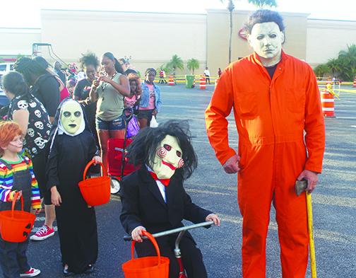 Families participate in Boo on the Avenue and Trunk or Treat.