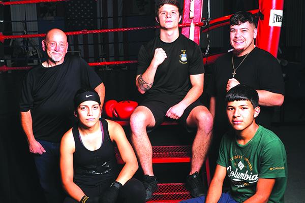 Representing Putnam County Sheriff’s Office PAL are boxers Loztris Vazquez, Ernesto Jimenez-Cruz, Coach John Brady, Robby Wells and Coach Faustino Garcia. (ALLISON WATERS-MERRITT / Special To The Daily News)
