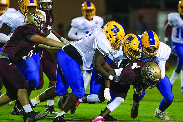 Palatka defenders Tavaris Scott, David Williams and DeShawn Shaw converge on a St. Augustine runner. (GREG OYSTER / Special To The Daily News)