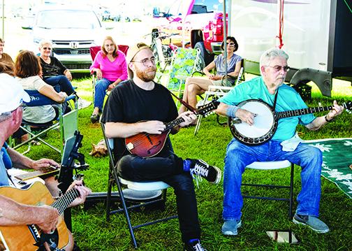 Guests at Rodeheaver Boys Ranch enjoy a jam session before the Fall Palatka Bluegrass Festival.