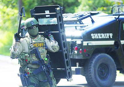 Putnam County Sheriff's Office deputies works during a raid in Palatka.