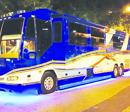 Joyce Oliver and friends attend University of Florida home games in this customized, Gator-themed bus prepare in Sanford.