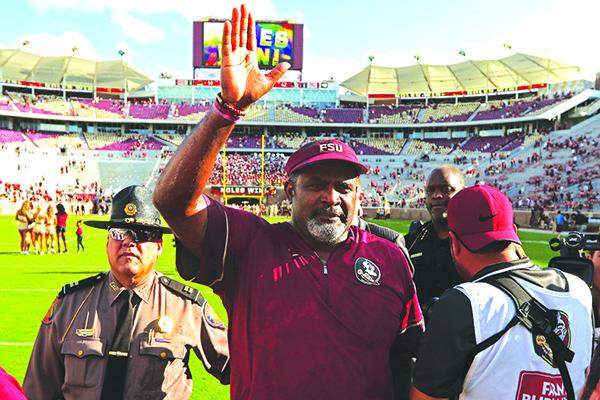 Odell Haggins waves to Florida State fans during his 2017 stint as interim head coach. (GREG OYSTER / Special To The Daily News)