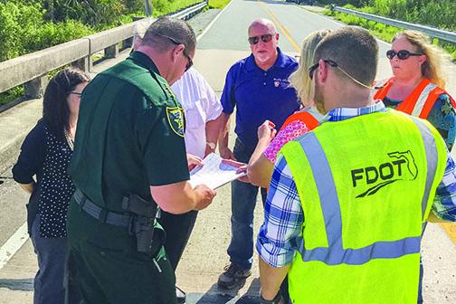 Local and state officials discuss the state of the County Road 310 bridge.