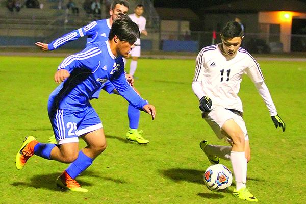 Crescent City’s Alex Galvan (11) looks for control of the ball against Keystone Heights’ Alex Cruz during the 2017 District 5-2A boys soccer championship at Keystone Heights High School. (Daily News file photo)