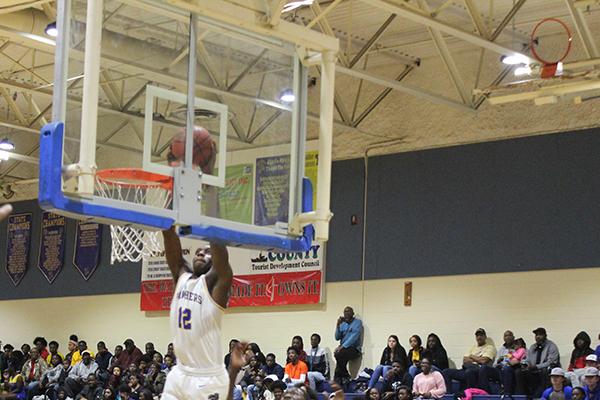 Palatka's Wesley Roberts delivers a slam dunk off a rebounded missed shot Wednesday night at home against Interlachen High. (MARK BLUMENTHAL / Palatka Daily News)