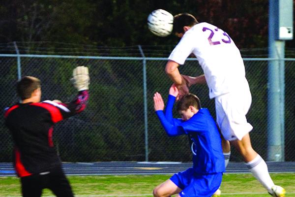 Crescent City's Veit Couturier leaps to score on a headball against Keystone Heights in the District 4-3A championship on Jan. 28, 2011, the first of his seven goals on the night. (Daily News file photo)