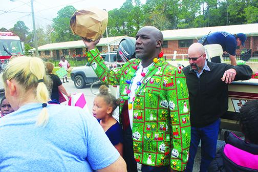 Palatka officials and residents enjoy the fire department's annual gift giveaway.