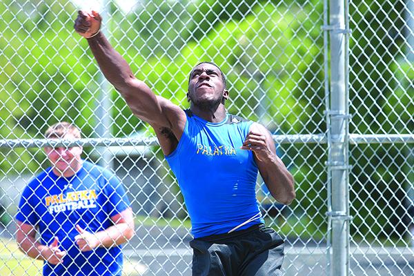 Palatka's Eron Carter launches a throw in the shot put during the 2015 Putnam County track championship at PHS. (Daily News file photo)