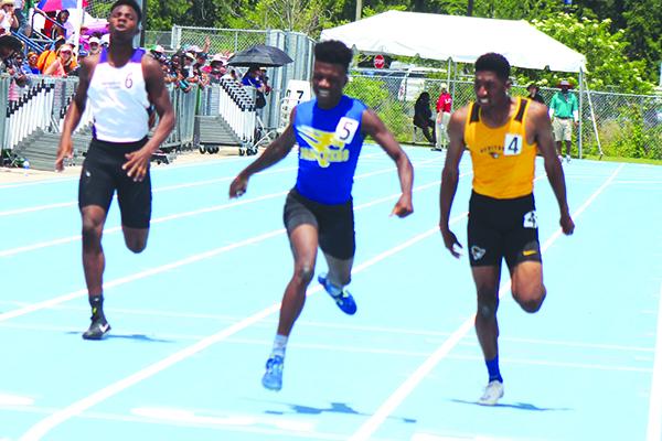 Palatka's Treyvon Williams (center) crosses the finish line first to win the FHSAA 2A 400-meter championship in 2019. (MARK BLUMENTHAL / Palatka Daily News)