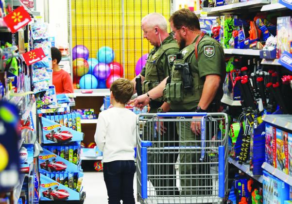 Deputies take local children on a shopping spree before Christmas. 