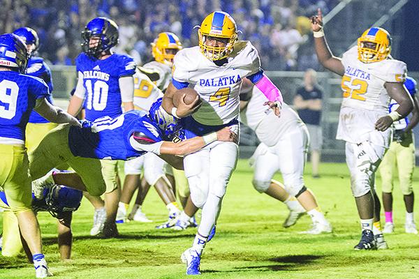 Palatka High School quarterback Mitchell McKinnon runs into the end zone for a touchdown in the Panthers' 66-65 loss to Menendez on Oct. 12, 2018. (Daily News file photo)