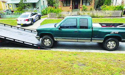 Police have a truck suspected to have been used in a car wash theft towed as evidence. 
