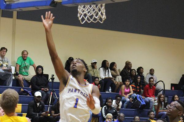 Palatka’s DeShawn Shaw (1) scores during Thursday night's opener against Longwood Lyman High in the Jarvis Williams Christmas Tournament. (ANDY HALL / Palatka Daily News)