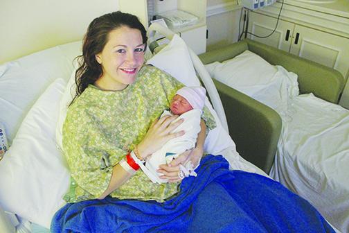 Shelby Hirinak holds her son, Gabrian, the first baby born at Putnam Community Medical Center in 2020.
