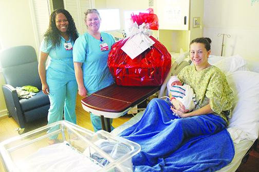 Shelby Hirinak holds her son, Gabrian, the first baby born at Putnam Community Medical Center in 2020.