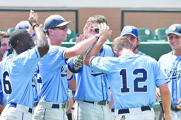 St. Johns River State College baseball player Myles Straw (12) is congratulated by teammates after scoring a run in the Vikings' 16-9 17-inning victory over Gulf Coast State in the 2015 FCSAA/NJCAA Region 8 baseball tournament at Joker Marchant Stadium in Lakeland. (File photo)
