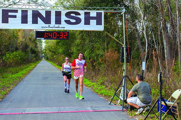 John Webb and Holly Sanford were way out in front in the half marathon. (Sue Price Photography)