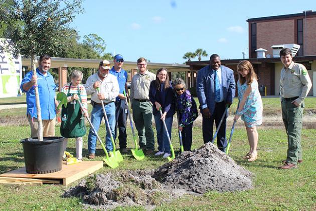 City of Palatka officials and other community leaders mark Arbor Day with preparations to plant a live oak tree at SJR.