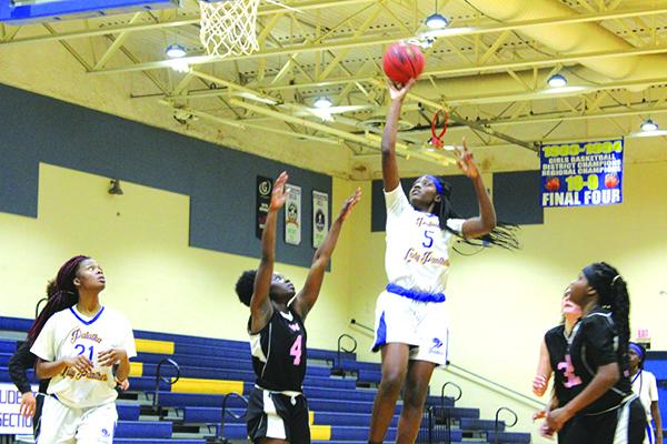 Palatka’s Amareya Turner goes for two of her game-high 12 points against Wolfson Monday night. (MARK BLUMENTHAL / Palatka Daily News)