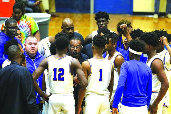 PHS coach Bryant Oxendine huddles with the Panthers during a January victory over Palm Coast Matanzas. (GREG OYSTER / Special To The Daily News)