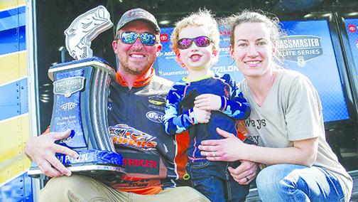 Paul Mueller celebrates his victory in the 2020 AFTCO Bassmaster Elite Series on the St. Johns River with his wife, Kimber, and son, Waylon, Monday at the Palatka riverfront.
