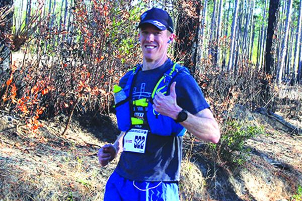 Adam Vernedoe of Gainesville flashes a thumbs up. He was the third male in the 50-mile race. (MARK BLUMENTHAL / Palatka Daily News)