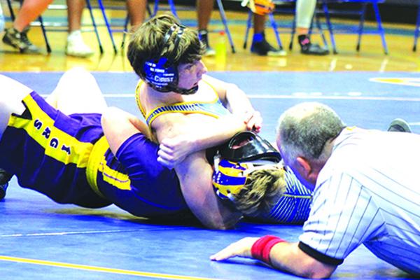 Pictured in a Feb. 11 match against Union County, Palatka’s Adaris Medina bounced back from a first-round pinfall Wednesday to pin his next two opponents and finish third in the 145-pound class in District 5-1A. (ANDY HALL / Palatka Daily News)