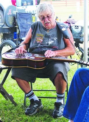 Bluegrass fans make music of their own before the Spring Palatka Bluegrass Festival.