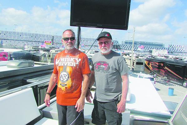 Jeff Curtis of Palatka with his brother Rick Curtis atop their RV on the infield at Daytona International Speedway. (WAYNE SMITH / Palatka Daily News)