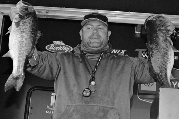 FLW Toyota Truck Series leader Jason Blair holds up some of his catch from Friday’s round. (GREG WALKER / Special To The Daily News)