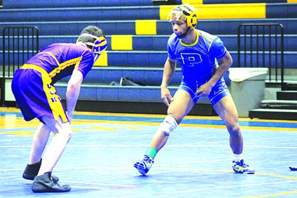 Palatka's Ontarriyus Reid (right) is 34-11 as he gets ready to compete in the District 5-1A championship meet. (ANDY HALL / Palatka Daily News)