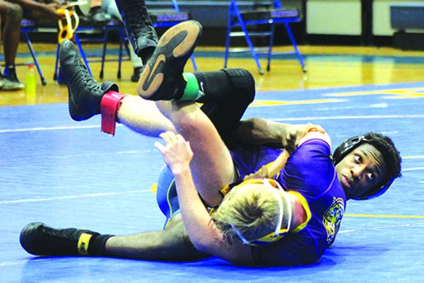 Palatka’s Drevon Wallace (right) brings a 34-12 record into today’s District 5-1A wrestling championship meet at Menendez High School. (ANDY HALL / Palatka Daily News)