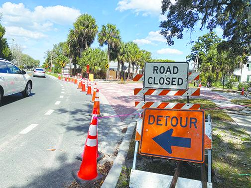 Cars detour around construction as the Palatka Public Works Department repaves the intersection of Ninth Street and Crill Avenue.