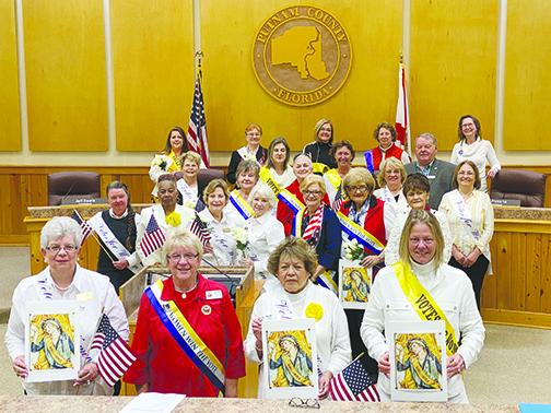 Local Woman’s Club chapter presidents celebrate the 100th anniversary of the 19th Amendment on Friday.