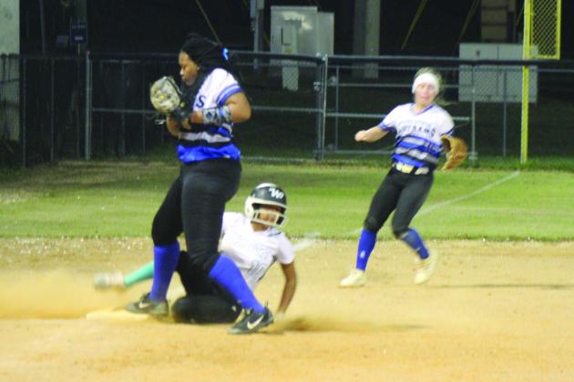 Interlachen High School third baseman Janae Green makes it to the bag to force out West Port's Tiara Chavis in the fifth inning Tuesday night. (MARK BLUMENTHAL / Palatka Daily News)