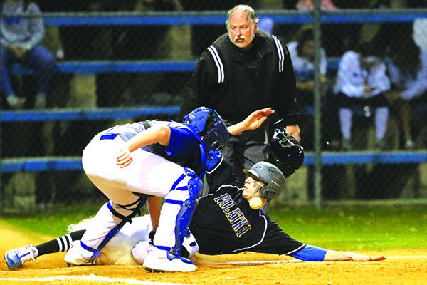 Palatka’s Trace Ogle slides home ahead of the throw to Peniel catcher Westin Lassiter.  (GREG OYSTER / Special To The Daily News)