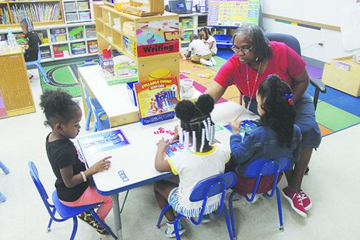 Teacher Faye Williams instructs prekindergarten students Thursday at Moseley.