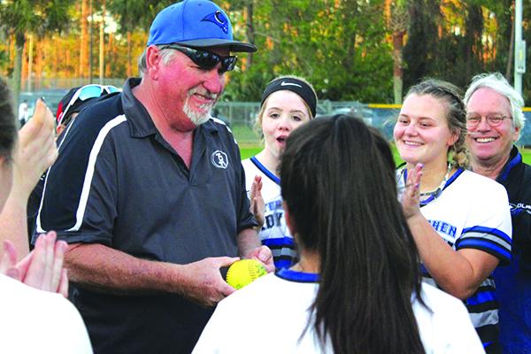 Interlachen coach Ron Whitehurst is applauded by players after recording his 200th career victory. (MARK BLUMENTHAL / Palatka Daily News)